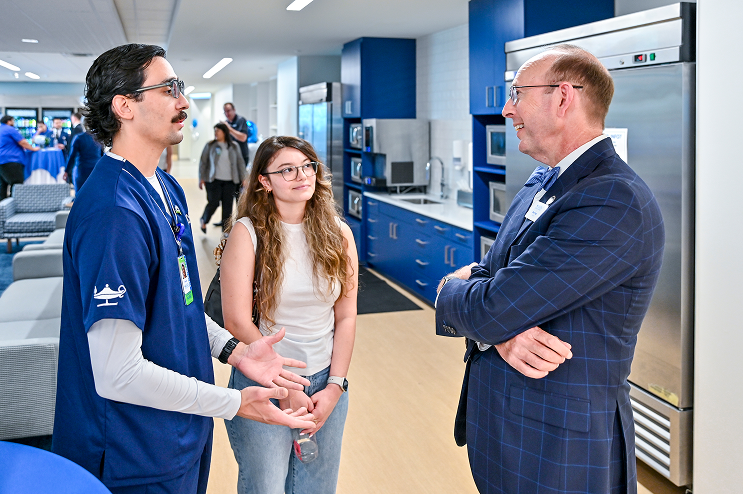 Galen College of Nursing CEO Mark Vogt (right)
speaks to students at the ribbon cutting ceremony
for Galen’s new San Antonio campus in May 2025.